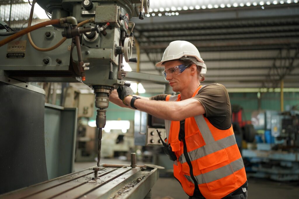 Factory Engineer Operating machines in industry factory.