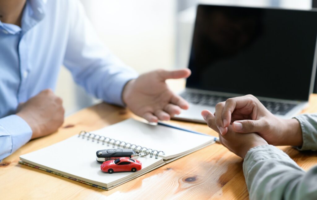 Insurance broker is recommending auto accident insurance to clients.